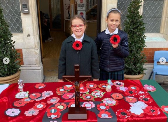 Girls with poppies on Remembrance